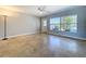 This bright living room has beautiful travertine flooring and a large window that lets in lots of natural light at 10754 63Rd Ave, Seminole, FL 33772