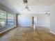 Spacious living room with large windows bringing in plenty of natural sunlight to brighten up the space at 10754 63Rd Ave, Seminole, FL 33772