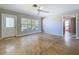 Bright living room showcasing tile floors, neutral paint, and a storm door with direct access to outside at 10754 63Rd Ave, Seminole, FL 33772