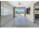 Sunroom with view of pool and access to yard at 10754 63Rd Ave, Seminole, FL 33772