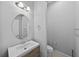 Half-bathroom features a mirror, toilet, and a vanity at 11503 Quiet Forest Dr, Tampa, FL 33635