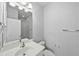 Well-lit bathroom featuring a single sink vanity and glass-enclosed shower at 11503 Quiet Forest Dr, Tampa, FL 33635