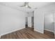 Spacious bedroom featuring laminate wood flooring and entryways to closet and bathroom at 11503 Quiet Forest Dr, Tampa, FL 33635