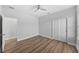 Bedroom featuring a ceiling fan, closet, and luxury vinyl plank flooring at 11503 Quiet Forest Dr, Tampa, FL 33635