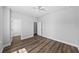 Bedroom with hardwood floors and view of the walk-in closet at 11503 Quiet Forest Dr, Tampa, FL 33635