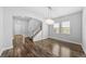 Dining room featuring hardwood floors, a chandelier, and an open floor plan at 11503 Quiet Forest Dr, Tampa, FL 33635