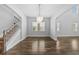Dining room featuring hardwood floors, a chandelier, and an open floor plan at 11503 Quiet Forest Dr, Tampa, FL 33635