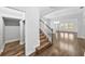 Entryway featuring hardwood floors, staircase, chandelier, and an open floor plan at 11503 Quiet Forest Dr, Tampa, FL 33635