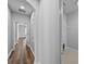 Hallway leading to the bedrooms, laundry, and main living areas of this home at 11503 Quiet Forest Dr, Tampa, FL 33635