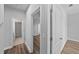 Hallway with neutral paint and access to bedrooms, with a bath in view at 11503 Quiet Forest Dr, Tampa, FL 33635