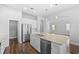 Updated kitchen with granite countertops, stainless appliances, and a central island at 11503 Quiet Forest Dr, Tampa, FL 33635