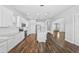 Spacious kitchen with stainless steel appliances, white cabinetry, and an island with bar seating at 11503 Quiet Forest Dr, Tampa, FL 33635