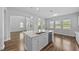 Bright kitchen with stainless appliances, an island with granite countertops, and a breakfast bar at 11503 Quiet Forest Dr, Tampa, FL 33635