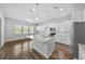 Modern kitchen featuring granite countertops, stainless appliances, and white cabinetry at 11503 Quiet Forest Dr, Tampa, FL 33635