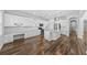 Open kitchen design with an island, stainless appliances, white cabinets, and a built-in workstation at 11503 Quiet Forest Dr, Tampa, FL 33635