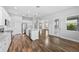 Modern kitchen featuring stainless appliances, a central island, and access to the outdoor patio at 11503 Quiet Forest Dr, Tampa, FL 33635