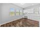 Bright eat-in kitchen with built-in desk space and view of pond at 11503 Quiet Forest Dr, Tampa, FL 33635