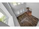 Open-concept living room showcasing hardwood floors, natural light, and a view into the kitchen at 11503 Quiet Forest Dr, Tampa, FL 33635