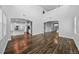 Open-concept living room with wood floors and kitchen view at 11503 Quiet Forest Dr, Tampa, FL 33635