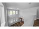 Spacious room features hardwood floors, great natural light, and neutral wall paint at 11503 Quiet Forest Dr, Tampa, FL 33635