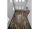 Bright living room featuring hardwood floors and several windows for ample natural light at 11503 Quiet Forest Dr, Tampa, FL 33635