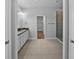 Main bathroom showcasing a double vanity, tile flooring, and a stand up shower at 11503 Quiet Forest Dr, Tampa, FL 33635