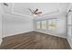 Main bedroom with hardwood floors, tray ceilings, ceiling fan, and lots of natural light at 11503 Quiet Forest Dr, Tampa, FL 33635