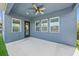 Covered patio with ceiling fan overlooking backyard at 11503 Quiet Forest Dr, Tampa, FL 33635