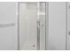 Modern bathroom shower with glass enclosure and white tile at 11503 Quiet Forest Dr, Tampa, FL 33635