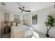 Bright bedroom featuring neutral tones, stylish decor, and a modern ceiling fan at 1160 36Th N Ave, St Petersburg, FL 33704