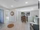 Bright dining area featuring a wooden table set by a window, with kitchen appliances in the periphery at 1160 36Th N Ave, St Petersburg, FL 33704