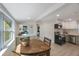 Bright dining and kitchen area, features a wooden table with outside view in a naturally lit space at 1160 36Th N Ave, St Petersburg, FL 33704