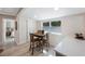 Cozy dining area with wood table and chairs, adjacent to kitchen and a sliding door for convenience at 1160 36Th N Ave, St Petersburg, FL 33704
