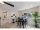 Bright dining area with an open view to the living room, featuring a modern table and stylish bar stools at 1160 36Th N Ave, St Petersburg, FL 33704