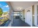 Inviting front porch with a ceiling fan and space for seating, offering a relaxing outdoor area at 1160 36Th N Ave, St Petersburg, FL 33704