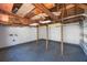 Spacious garage with exposed rafters and beams and a newly coated floor at 1160 36Th N Ave, St Petersburg, FL 33704
