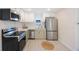 Modern kitchen with stainless steel appliances, sleek cabinetry, and ample counter space at 1160 36Th N Ave, St Petersburg, FL 33704