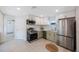 Remodeled kitchen with stainless steel appliances and two-tone cabinets at 1160 36Th N Ave, St Petersburg, FL 33704