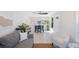 Inviting living space featuring a cozy sitting area and a dining area, complete with modern light fixtures at 1160 36Th N Ave, St Petersburg, FL 33704
