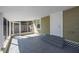Screened-in patio with neutral paint, grey stone flooring and steps to the backyard at 1160 36Th N Ave, St Petersburg, FL 33704