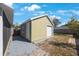 Detached shed in backyard with siding and a roll up garage door at 1160 36Th N Ave, St Petersburg, FL 33704