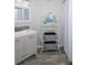 Well-lit bathroom features modern vanity, mirror, decor, modern shelving and flooring at 1226 S Missouri Ave # 1013, Clearwater, FL 33756