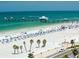 Picturesque beach scene with umbrellas, beachgoers, and a long pier at 1226 S Missouri Ave # 1013, Clearwater, FL 33756