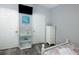 Bedroom with beach-themed decor, wood-look flooring, and modern furniture at 1226 S Missouri Ave # 1013, Clearwater, FL 33756