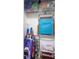 A well-organized closet equipped with shelves and containing beach and pool essentials, including beach chairs and boogie boards at 1226 S Missouri Ave # 1013, Clearwater, FL 33756