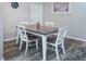 Dining room features a modern wood table with seating for four, art, and decor at 1226 S Missouri Ave # 1013, Clearwater, FL 33756