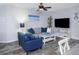 Cozy living room with plush seating, nautical decorations, and lots of natural light at 1226 S Missouri Ave # 1013, Clearwater, FL 33756