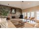 Inviting living room featuring a stone fireplace, neutral colors, and sliding glass doors at 1226 S Missouri Ave # 1013, Clearwater, FL 33756