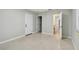 Bedroom with three doorways, featuring a window with blinds and neutral wall paint at 1231 27Th S Ave, St Petersburg, FL 33705