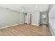Bright bedroom featuring new flooring, modern ceiling fan, and multiple doors at 1231 27Th S Ave, St Petersburg, FL 33705